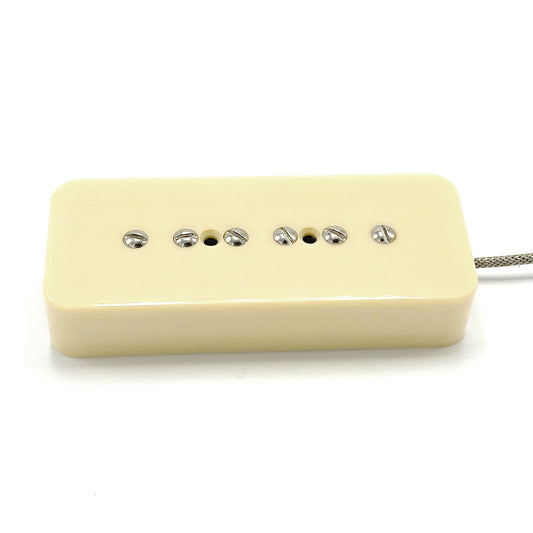 One P90 style pickup with fillister screw poles and ivory color cover.