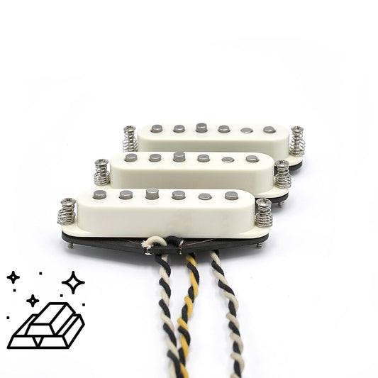 Three pickups for Stratocaster electric guitars with vintage staggered poles and parchment covers