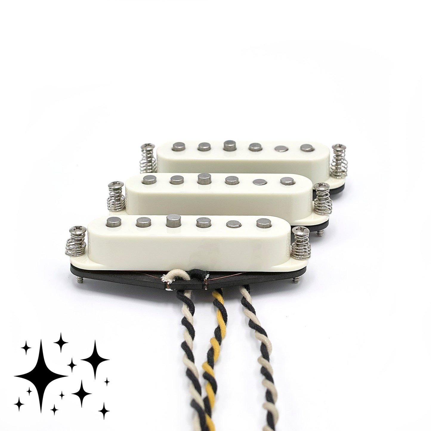 Three pickups for Stratocaster electric guitars with vintage staggered poles and parchment covers