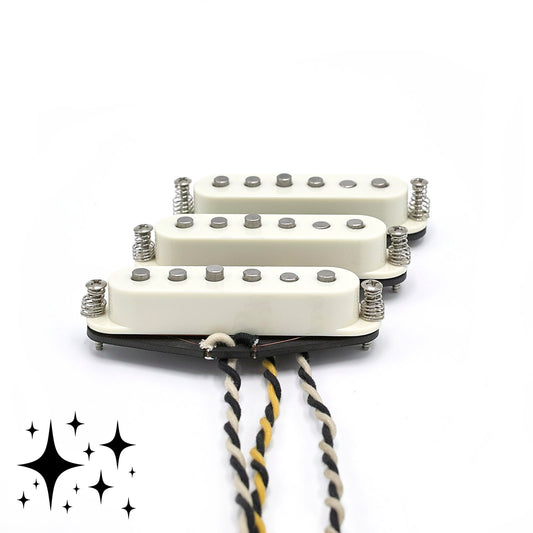 Three pickups for Stratocaster electric guitars with vintage staggered poles and parchment covers