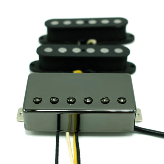 two single coil pickups with no cover and one humbucker with black chrome cover