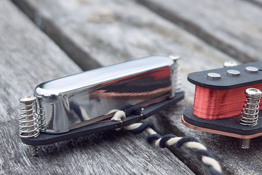 close up photo of t style neck pickup with chrome cover