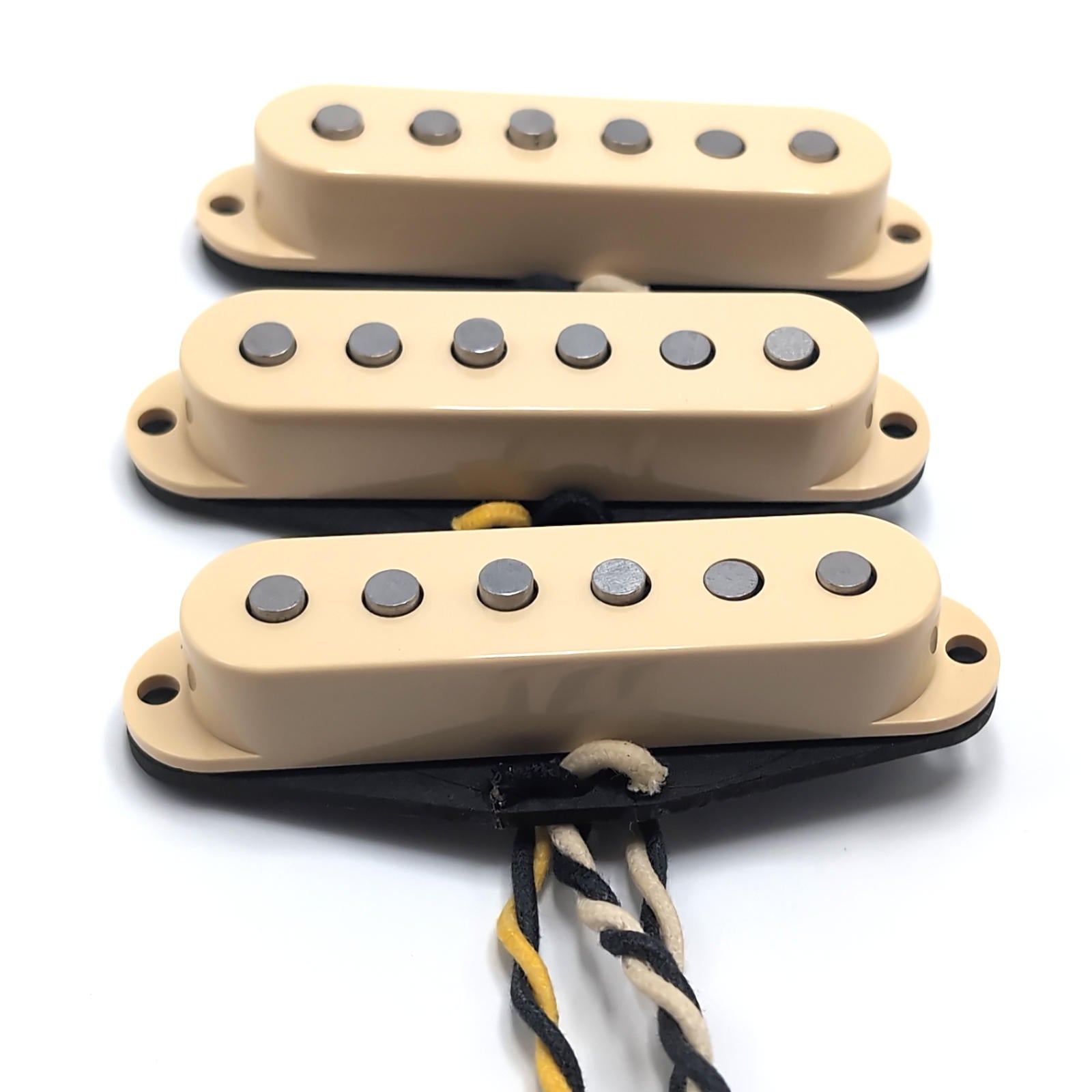 Three vintage pro pickups with cream covers