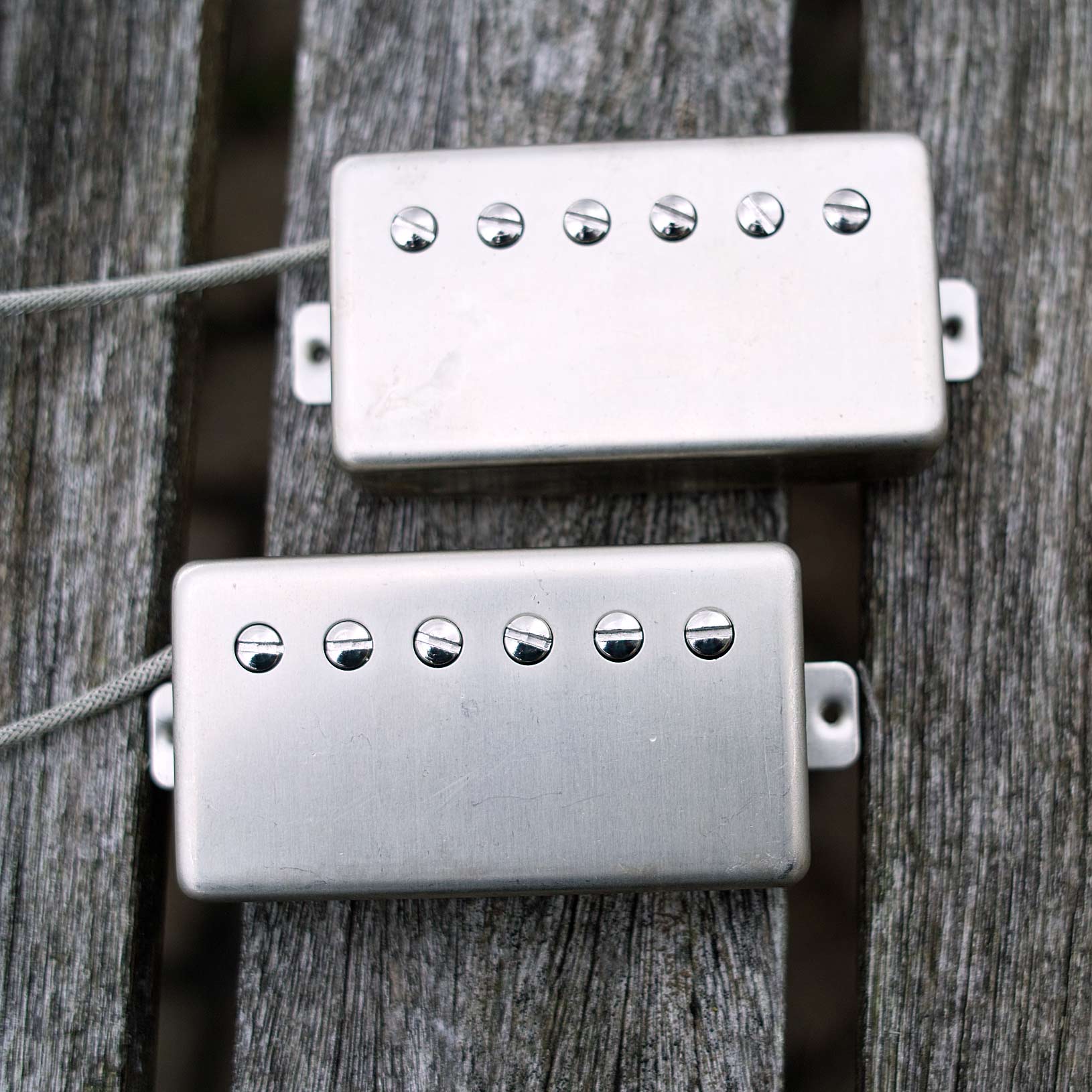 two humbuckers with raw nickel covers