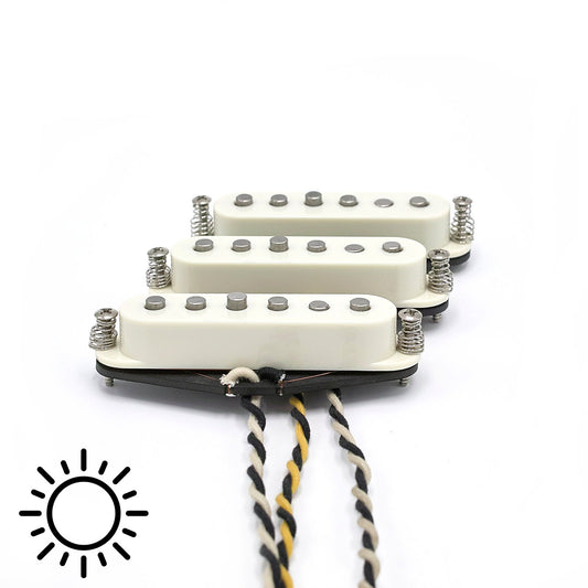Three pickups for S-style electric guitars with vintage staggered poles and parchment covers